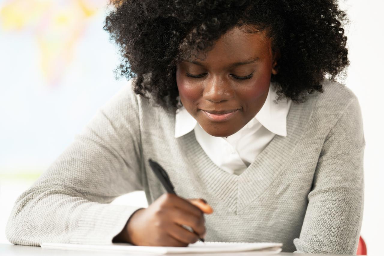 A child working through their math homework
